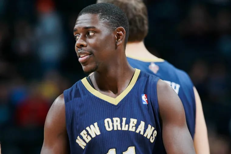 Pelicans guard Jrue Holiday takes court to face the Denver Nuggets in the first quarter of an NBA basketball game in Denver on Sunday, Dec. 15, 2013. (David Zalubowski/AP)