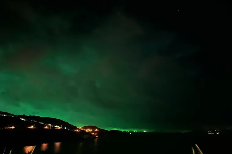 A green aurora illuminates the night sky over Nangan, in Taiwan's Matsu Islands in September. Philly might get its turn Saturday night.