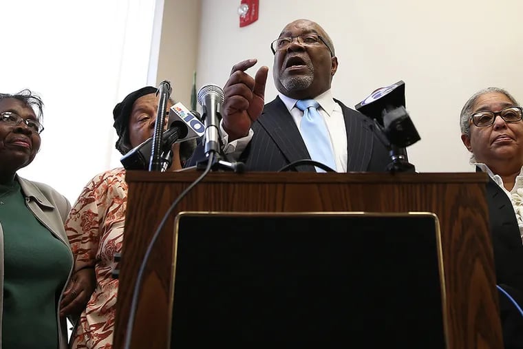 State Rep. W. Curtis Thomas, center, calls for the elimination of School Reform Commission during a news conference at his office in Philadelphia on October 9, 2014. ( DAVID MAIALETTI / Staff Photographer )