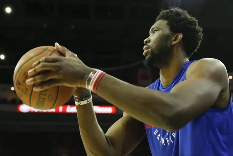Sixers center Joel Embiid shoots the basketball during warm-ups before the Sixers play the Miami Heat in game two of the Eastern Conference quarterfinals on Monday, April 16, 2018 in Philadelphia. YONG KIM / Staff Photographer