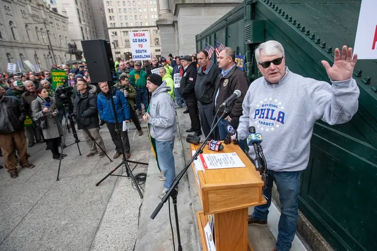 John Dougherty (right), business manager of the Philadelphia Building and Construction Trades Council, at a Jan. 30 rally to support workers at a closed-down oil refinery.
