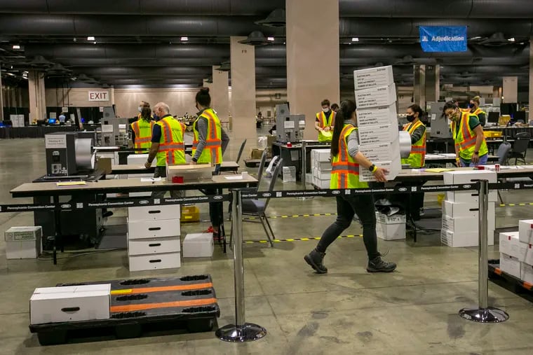 Workers counting Philadelphia mail ballots during the 2020 election.