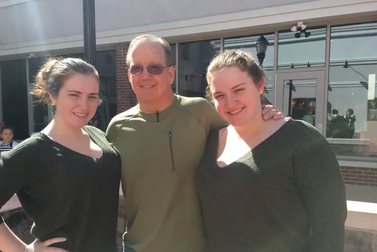 From left to right, Jill Egan, Tom Egan, Elizabeth Egan of Gibbsboro, NJ, posed after seeing a movie. Tom Egan has early-onset Alzheimer's disease and his daughters participate in his care.