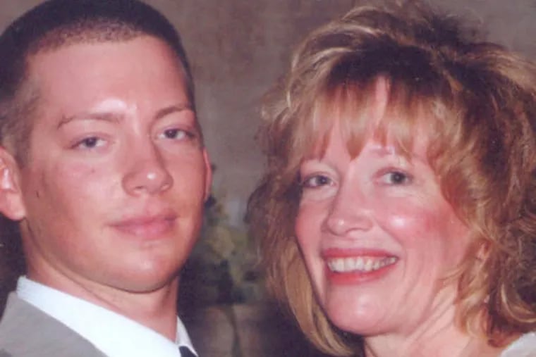 Michael John Fox with his mother, Diane. He was beaten to death in his bedroom in Bella Vista in 2012, a case that remains unsolved.