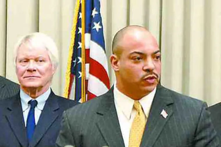 D.A. Seth Williams on first day in office, with key staff members, including Joseph McGettigan, standing next to Williams. (Tom Gralish / Staff)