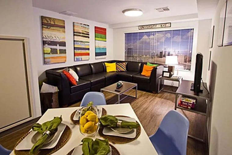 Living room and dining area of a model double-bedroom unit in Chestnut Square dorm at Drexel