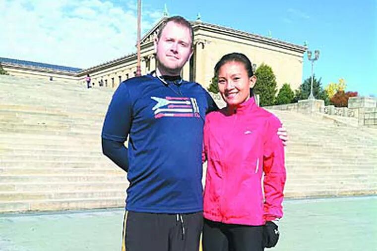 Jim and Sophorn Smiley at the Art Museum before a run. She says she runs to honor her parents, who fled the Khmer Rouge.
