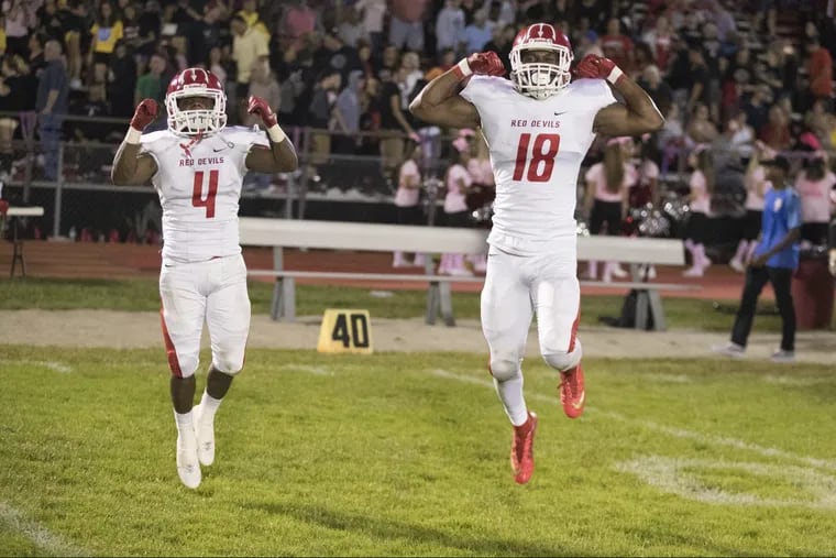Marc Sykes, Jr., left, and Allan Watson of Rancocas Valley celebrate after their 10-7 win against Lenape on Oct. 6, 2017. CHARLES FOX / Staff Photographer