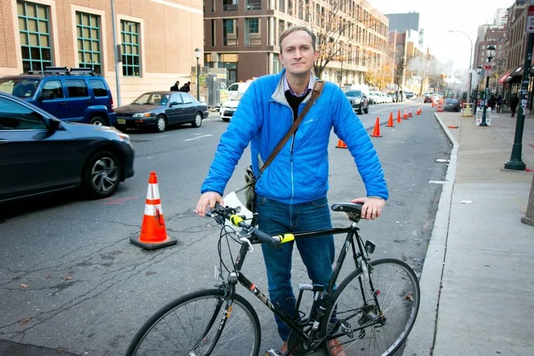 Dave Brindley in the DIY protected bike lane he made along the 3700 block of Spruce Street.