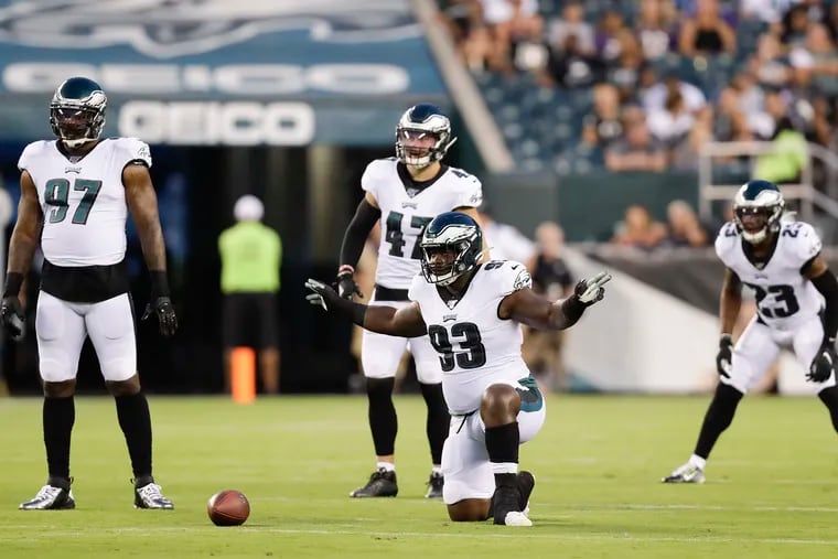 The loss of Malik Jackson (left) means more work for Tim Jernigan (93), pictured here with Nate Gerry (47) and Rodney McLeod (23) against the the Baltimore Ravens in a preseason game Thursday, August 22, 2019 in Philadelphia.