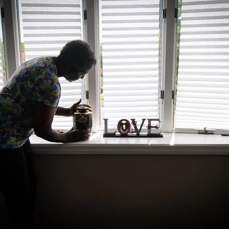 Hazel Rollerson, mother of Elwood Porter, who died of an overdose in the summer of 2021, shown here with the ashes of her son, in her home in Sicklerville, New Jersey, Tuesday, August 16, 2022.