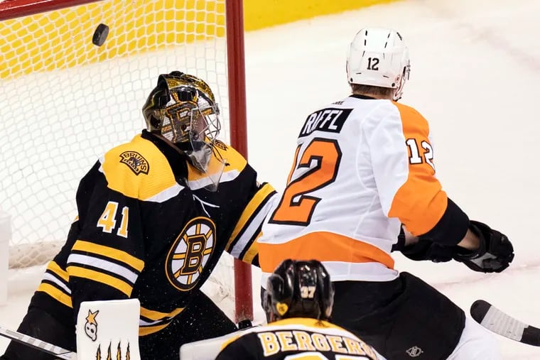 Flyers left wing Michael Raffl (12) scores against Boston Bruins goaltender Jaroslav Halak (41) during the second period.