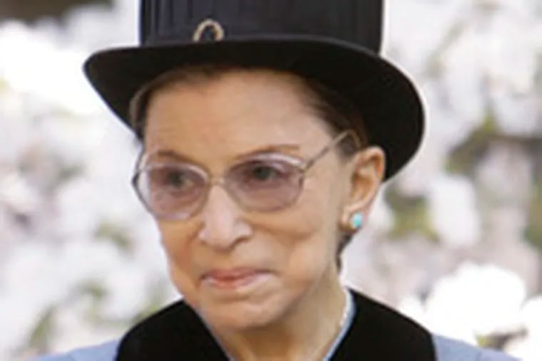 U.S. Supreme Court Justice Ruth Bader Ginsburg poses for a photograph before the commencement. In addition to the honorary degrees, about 6,000 others received diplomas.