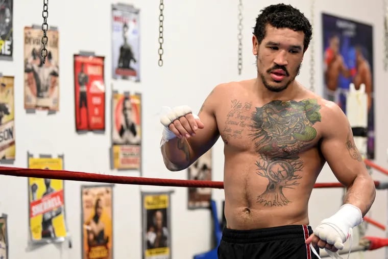 Undefeated welterweight prospect Paul Kroll works out at his gym.