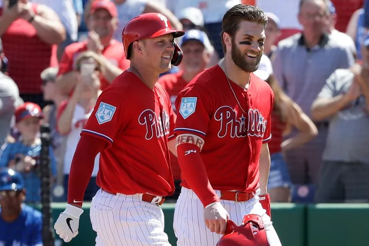 In Bryce Harper's spring-training debut, Rhys Hoskins batted him across the plate with a home run. "Get used to that," Harper told him.
