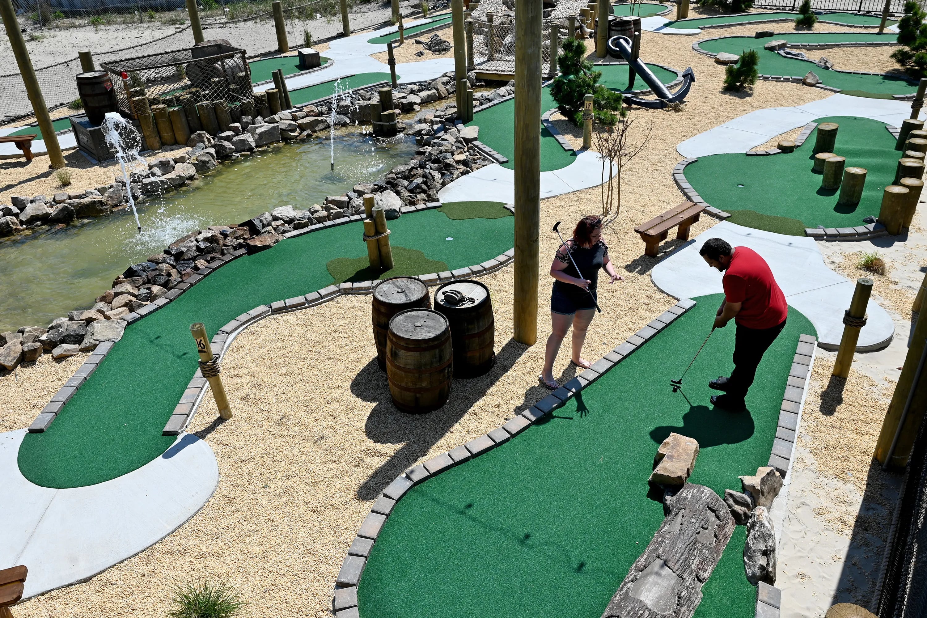 Catherine McCallister (left) of Little Egg Harbor and Jose Rivera (right) of Atlantic City play at North Beach Mini Golf in Atlantic City on May 22, 2022, one of the best mini golf spots at the Shore.