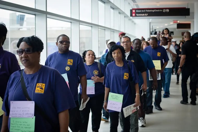 Airport workers and members of Service Employees International Union (SEIU) marched from Philadelphia International Airport’s Terminal F to Terminal B in 2013.