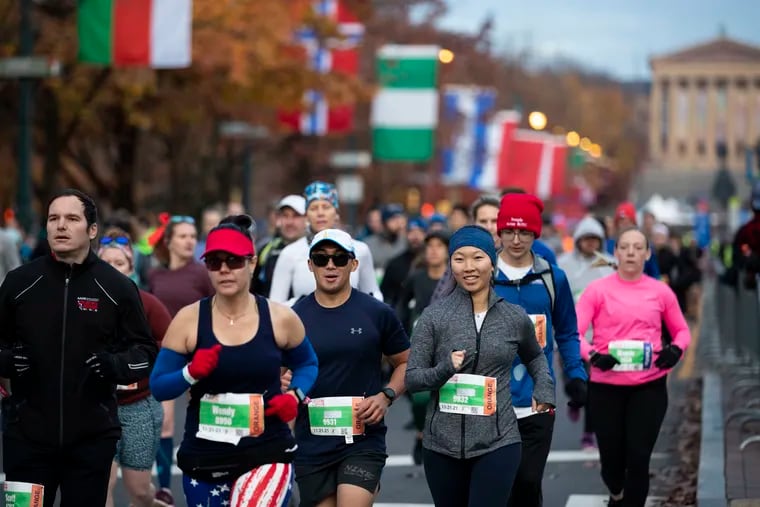 Runners take off down the Ben Franklin Parkway during the AACR Philadelphia Marathon in Philadelphia, Pa. on Sunday, November 21, 2021. The Philadelphia Marathon returned this weekend after a cancelation in 2020 due to the coronavirus pandemic.
