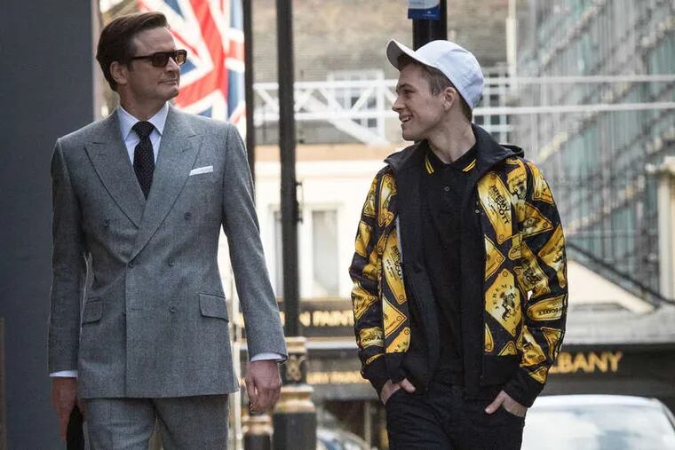 Colin Firth (left) with Taron Egerton in Matthew Vaughn's spy spoof &quot;Kingsman: The Secret Service.&quot;