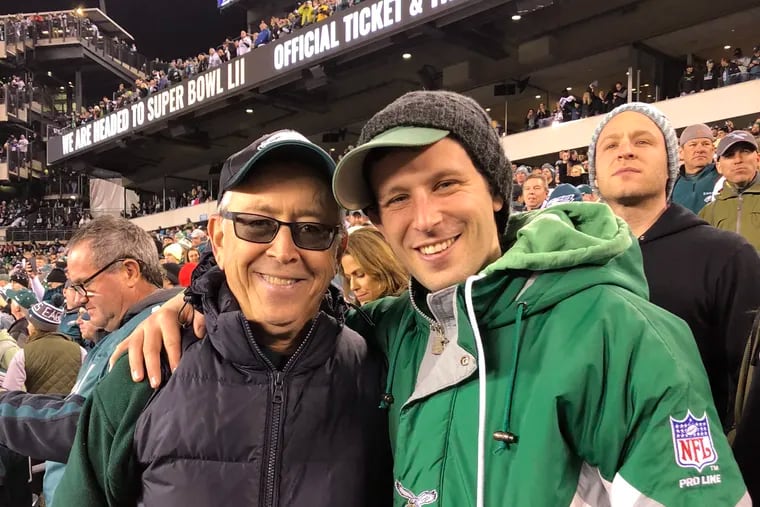 Gary Schildhorn, 67, and his son Brett at a 2018 Eagles playoffs game. Gary was nearly scammed out of $9,000 earlier this month when a person impersonated his son's voice and told him he was injured and needed help.