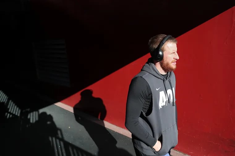 Quarterback Carson Wentz walks out of the FedEx Field tunnel to warm up before the Eagles faced Washington last Sunday in Landover, Md.
