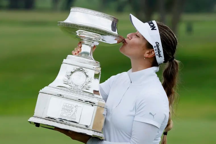 Hannah Green, of Australia, kisses the trophy after winning the 2019 KPMG Women's PGA Championship golf tournament in Chaska, Minn.