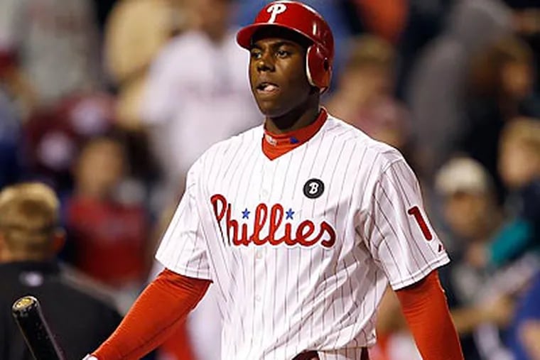 John Mayberry Jr. walks back to the Phillies' dugout after striking out to end the game. (Yong Kim/Staff Photographer)