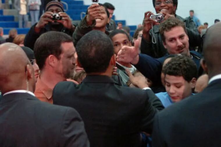 Sen. Barack Obama (center, back to camera) is greeted by members of the audience after speaking at a town-hall meeting in Greensburg, Pa. Today, he will speak in Johnstown.