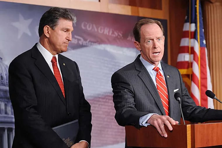 Sens. Pat Toomey (R., Pa.) and Joe Manchin III (D., W.Va.) announce their gun-law bill. Toomey became the second Pa. senator to back new gun laws - unthinkable as recently as November. OLIVIER DOULIERY /Abaca Press, MCT