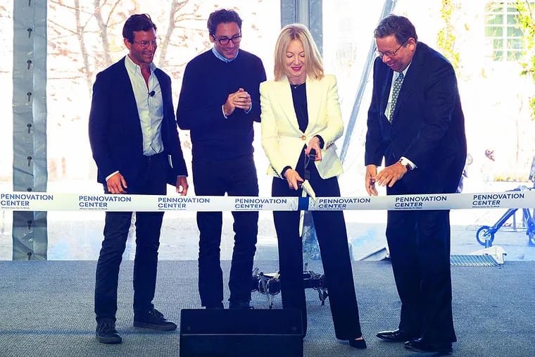 David L. Cohen, far right, at a ribbon cutting at the Pennovation Center. Left to right: David Gilboa and Neil Blumenthal, co-founders and co-CEOs of Warby Parker and  Penn president Amy Gutmann