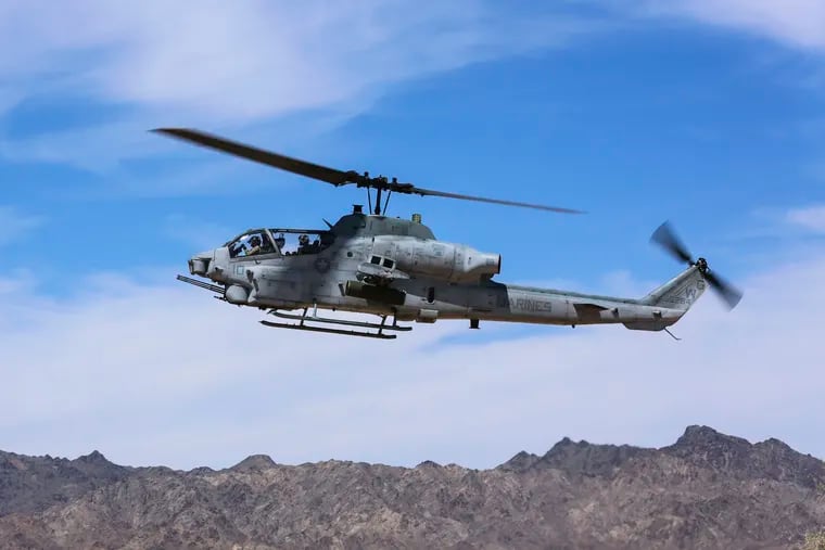 This April 17, 2017, photo released by the U.S. Marine Corps shows a AH-1Z Viper preparing to land at the Chocolate Mountain Aerial Gunnery Range, Calif. Two pilots were killed Saturday in an AH-1Z Viper helicopter crash while conducting a routine training mission near Yuma, Ariz. (Cpl. Harley Robinson/U.S. Marine Corps via AP)
