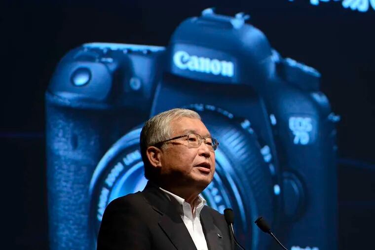 Masami Kawasaki, president of Canon Marketing Japan Inc., speaks during the unveiling in Tokyo on Tuesday of Canon's new EOS 7D Mark II digital single lens reflex camera. Canon, the world's largest camera maker, announced that the EOS 7D Mark II will go on sale in November. The new EOS model features a range of new technology, including rapid-burst shooting of up to 10 frames per second.