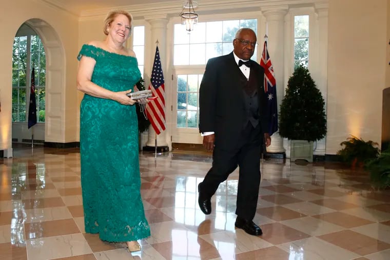 This Sept. 20, 2019 photo shows Supreme Court Associate Justice Clarence Thomas (right), and wife Virginia "Ginni" Thomas arriving for a State Dinner with Australian Prime Minister Scott Morrison and President Donald Trump at the White House.