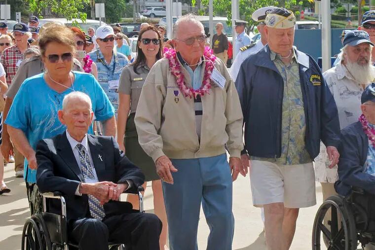 Above, USS Arizona survivors (from left) John Anderson, Donald Stratton, Louis Conter, and Lauren Bruner arrive in Pearl Harbor. The Japanese attack in 1941 killed about 2,400 troops.