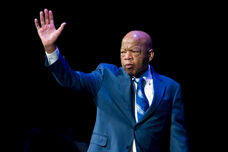 Rep. John Lewis, D-Ga., waves during a 2019 swearing-in ceremony of Congressional Black Caucus in Washington, D.C.