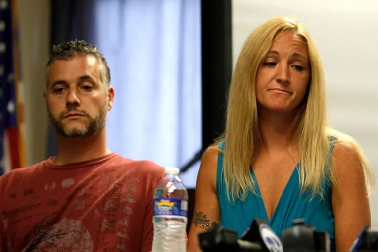 Dawn Centanni, sitting next to her husband Louis Centanni, reacts on Monday afternoon after telling about the passing of her mother, Carol Reiff. Reiff, 59, was reported missing June 21 and found June 24. Her body was badly decomposed and identified through dental records. (LUKE RAFFERTY/Staff Photographer).