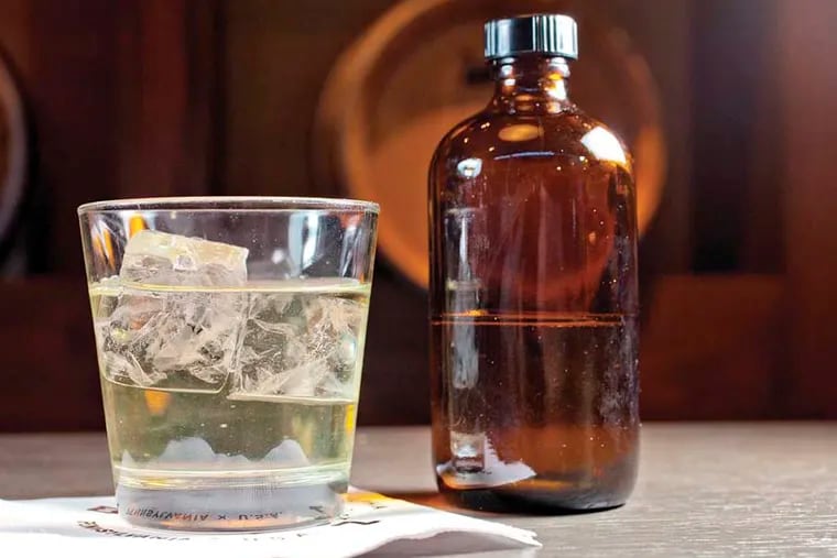 Secret Knock with punch of house aged whiskey, green tea and clarified milk as served at Bank and Bourbon, 1200 Market St., Philadelphia, November 20, 2014.  ( DAVID M WARREN / Staff Photographer )