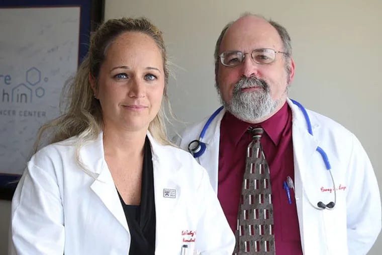Beth Eaby-Sandy (left), a nurse practitioner, with Dr. Corey Langer, a lung cancer specialist, at their office.