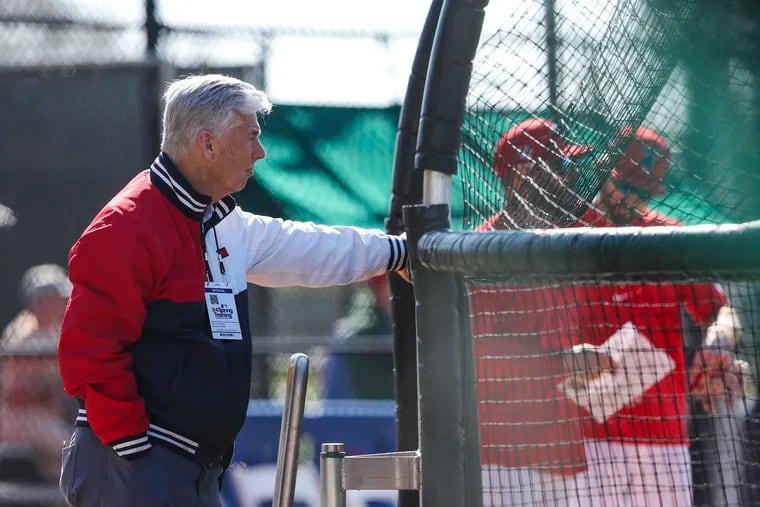 Dave Dombrowski watching from behind the batting cage during Phillies spring training in Clearwater, Fla. Of the team's starting pitching, Dombrowski says, "Well, I think we’re really comfortable with where we are right now.”