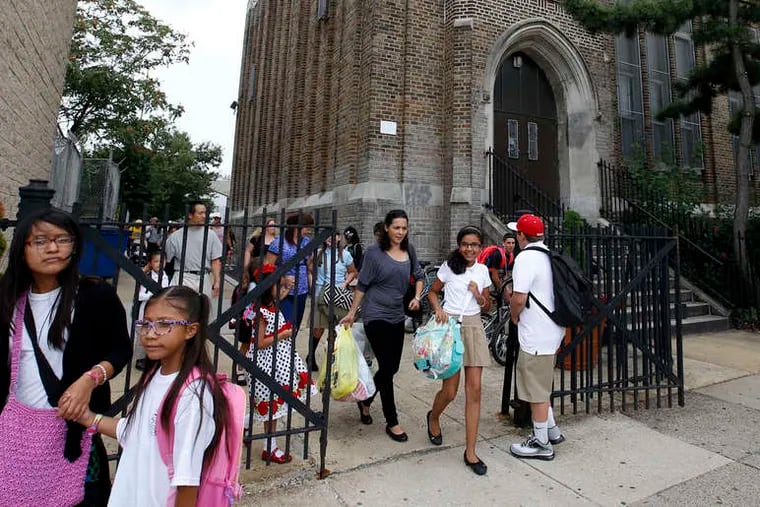 Dismissal time on the first day of school at William M. Meredith Elementary in Queen Village.