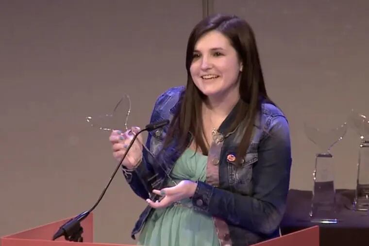 Gabby Frost accepts her award at the 2014 International Shorty Awards.