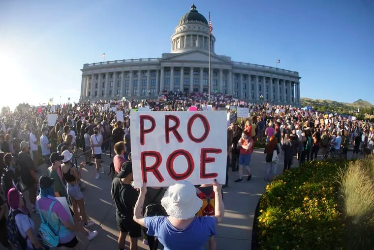 People attend an abortion-rights protest at the Utah State Capitol in Salt Lake City after the Supreme Court overturned Roe v. Wade.