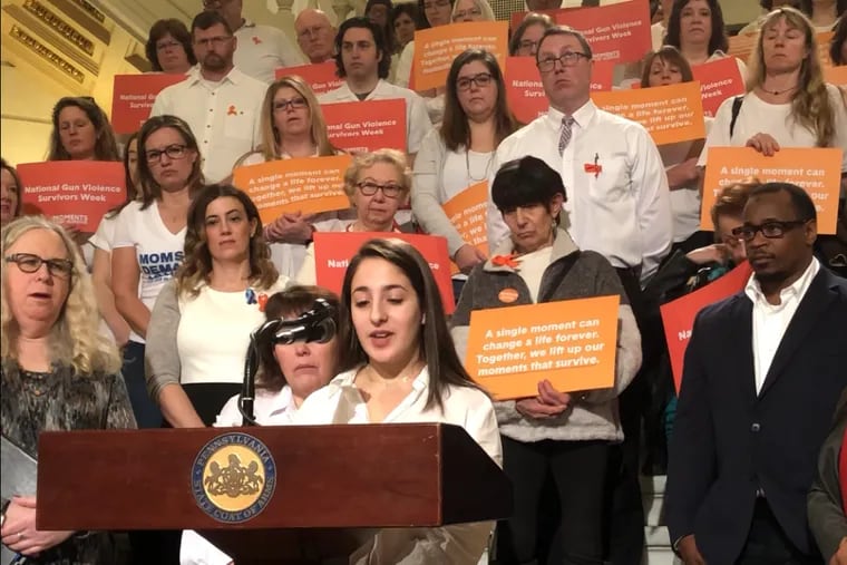 Catie Jacobson speaks on the steps of the Capital Building in Harrisburg about the effects of rural gun violence, specifically suicide and domestic violence, for National Survivors' Awareness Week alongside gun violence awareness group Wear Orange on Feb. 3, 2020.