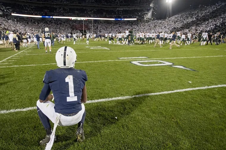 Penn State wide receiver KJ Hamler watches in disappointment as Michigan State celebrates a 21-17 win at Beaver Stadium in University Park, Pa., on Saturday, Oct. 13, 2018.