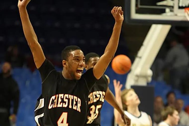 Chester's Maurice Nelson (4) and Erikk Wright celebrate after winning  the AAAA Boys PIAA State Basketball Championship. (Steven M. Falk/Staff Photographer)