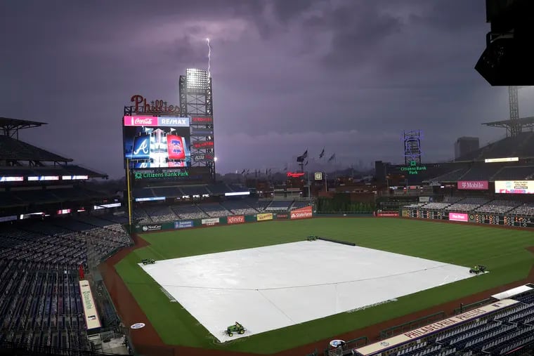 Lightning strikes over Citizens Bank Park in South Philadelphia before the Phillies play the Atlanta Braves on Friday.
