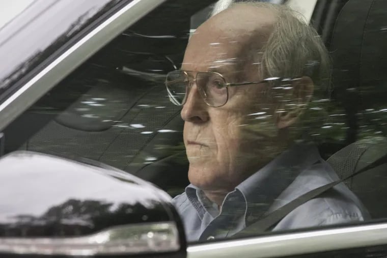 Charles Hallinan, the Villanova man prosecutors have described as the 'godfather of payday lending,'  leaves a parking garage on 5th and Market Streets after his July 6 sentencing in federal court in Philadelphia.