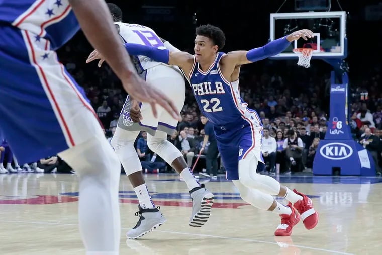 Sixers Matisse Thybulle tries to get around Kings # 13 Dewayne Dedmon during the Sacramento Kings at the Philadelphia 76ers NBA game at the Wells Fargo Center in Phila., Pa, on November 27, 2019. The Sixers won 97-91.
