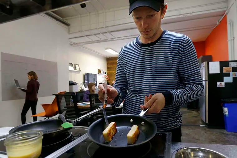 In this Feb. 4, 2015 photo Hampton Creek Foods pastry chef Ben Roche preparing french toast made with Just Scramble at their office in San Francisco. Hampton Creek’s mission is to replace the eggs in products without anyone noticing. In trying to appeal to the mainstream, co-founder and CEO Josh Tetrick has a simple rule. “Number one, never use the word ‘vegan,’” he said. (AP Photo/Jeff Chiu)