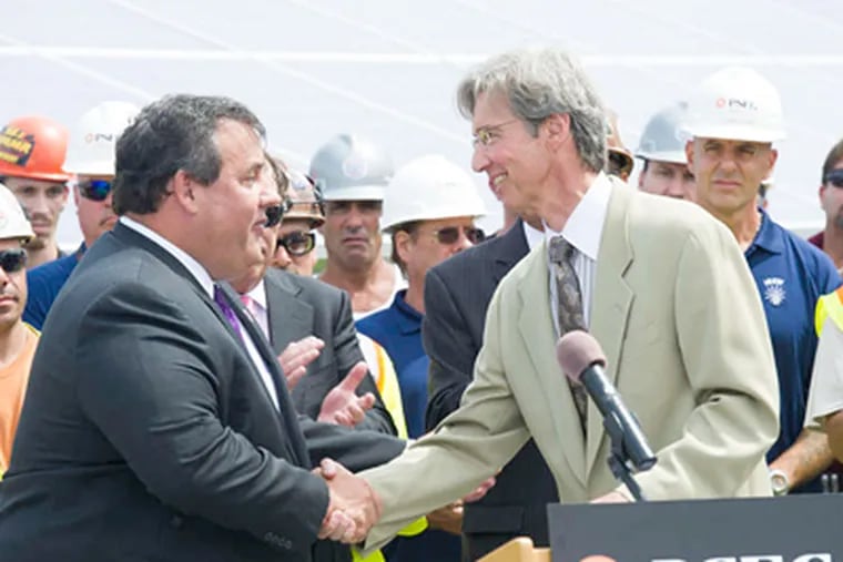 At the PSE&G Solar Farm groundbreaking Tuesday were Gov. Christie and utility CEO Ralph Izzo. One issue is whether ratepayers should subsidize the expanded solar program.